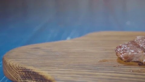 Sliced steak on cutting board Stock Footage 73816390