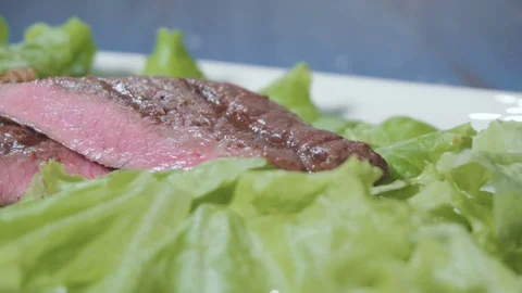 Sliced steak on a plate Stock Footage 73816403