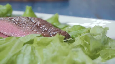 Sliced steak on a plate Stock Footage 73816414