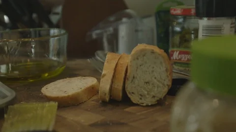 Sliced Stick Of Bread On Counter Top Stock Footage 121287727