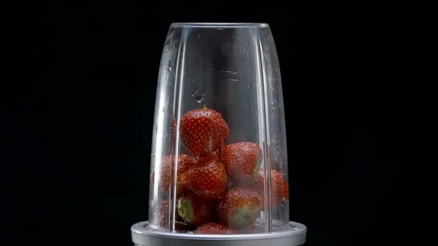 Sliced strawberries getting blended 動画素材 128719939