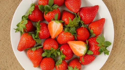 Sliced strawberries on a plate. Stock Footage 295834692