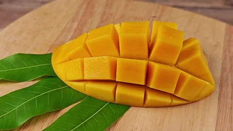 Sliced sweet mango on a plate. Stock Footage 307845536
