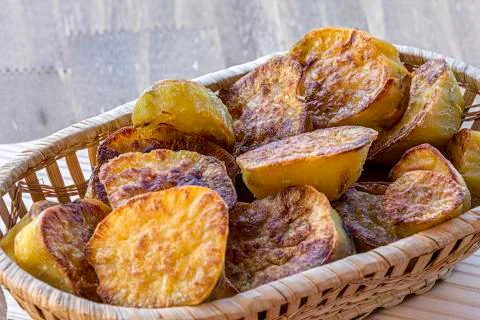 Sliced sweet potatoes on the table. Selective focus. Stock Photos
