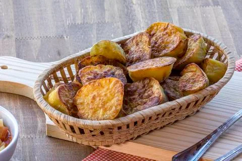 Sliced sweet potatoes on the table. Selective focus. Stock Photos