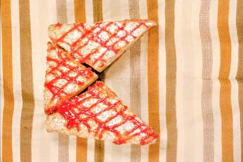 Sliced tasty cake on table background Stock Photos