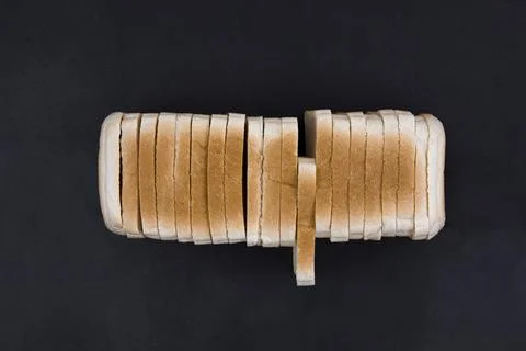 Sliced toasted bread on a dark background. Place for your text. Stock Photos