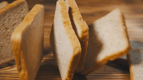 Sliced Toasted Bread Falling on a Table. Slow Motion. Stock Footage 116177921
