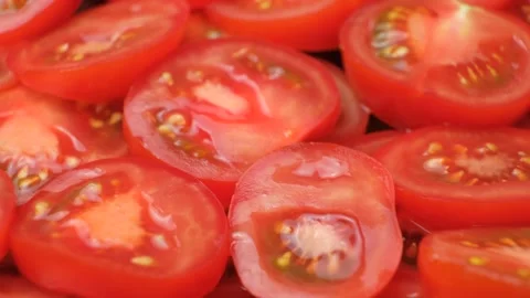 Sliced Tomato Circles Close-Up. Fresh Culinary Vegetable Background Rotate. Stock Footage 314741052