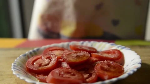 Sliced tomato dressed with oregano. Stock Footage 135605113