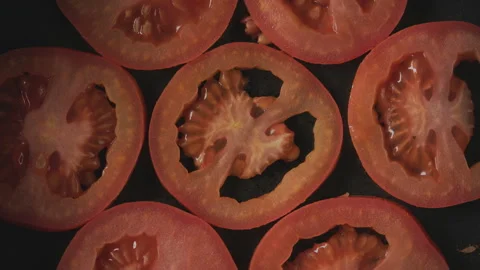 Sliced tomatoes on grill frying Stock Footage 274646988