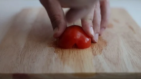 Sliced tomatoes on the kitchen board Stock Footage 127703554