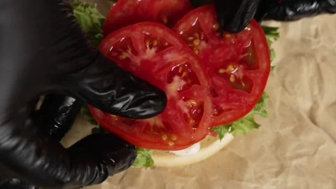 Sliced ​​tomatoes on lettuce leaves Stock Footage 297004257