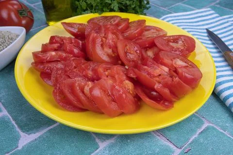 Sliced tomatoes on a table Stock Photos
