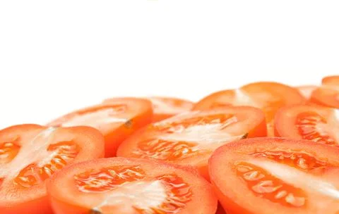 Sliced tomatoes on a white background close-up Stock Photos