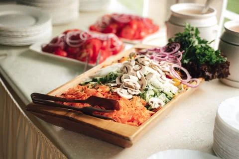 Sliced various fresh vegetable on buffet table for vegetable garnish to main Stock Photos