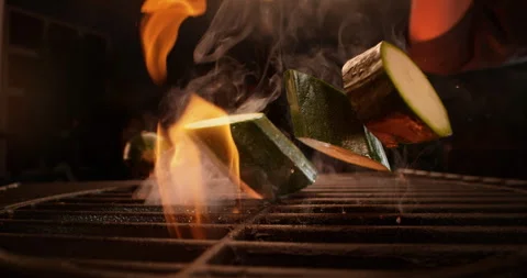 Sliced vegetable falling on grill Video stock 311831974