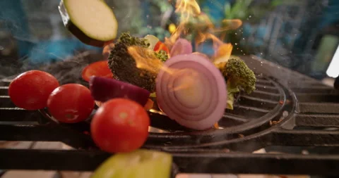 Sliced vegetables falling on grill 스톡 동영상 311831786
