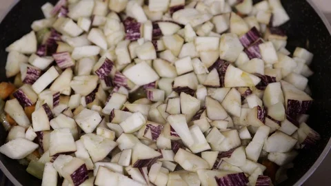 Sliced vegetables on a frying pan Stock Footage 129058623