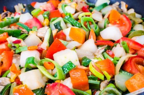 Sliced vegetables in the pan Stock Photos