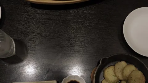 Sliced Wagyu Beef Steak on Sizzling Iron Plate with Vegetables in Japan Stock Footage 339915908