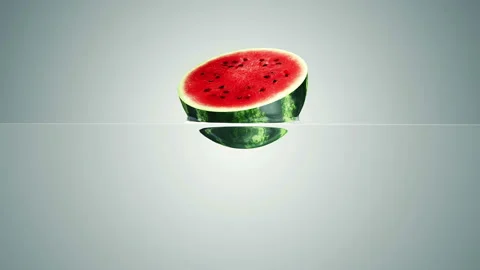 Sliced Watermelon Falling into Water with Splashes Stock Footage 127695442