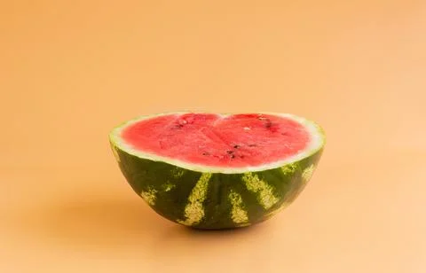 Sliced watermelon on an orange background Stock Photos