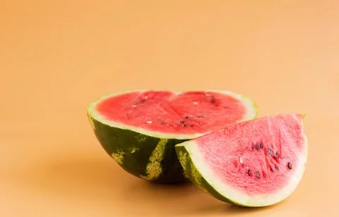 Sliced watermelon on an orange background Stock Photos