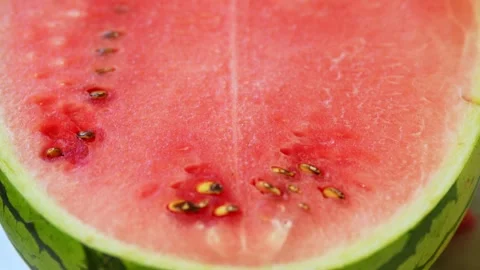 Sliced watermelon piece on a silver platter with background blur. Stock Footage 341562963