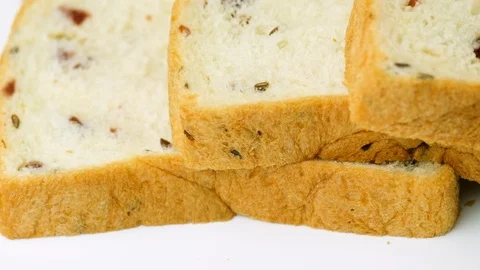Sliced wheat bread with bran, isolated on white. Stock Footage 114877966