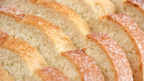 Sliced wheat bread slider shot. Texture of baked porous bread close-up Stock Footage 246741194