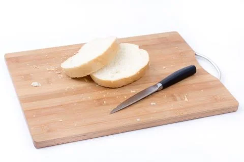 Sliced white bread and knife on the cutting board Stock Photos