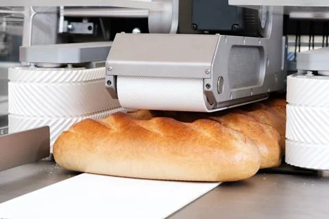 Sliced white bread in a cutting machine Stock-Fotos