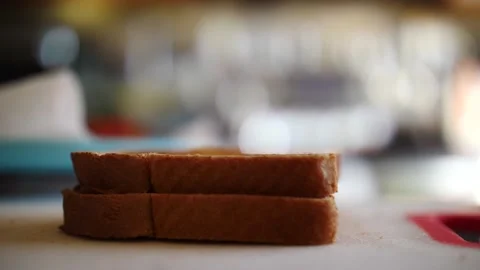 Sliced white bread falling as slow motion on table ready to make a sandwich Stock Footage 206572966