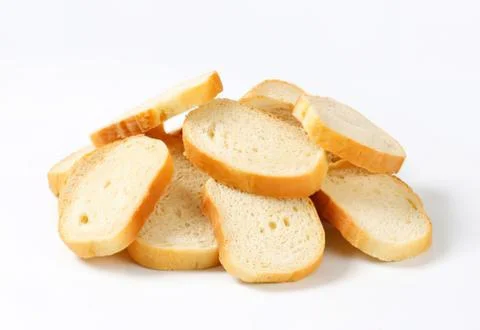 Sliced white bread pieces on plain background Stock Photos