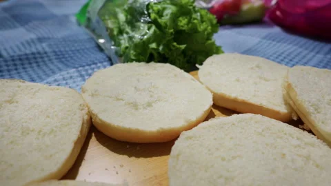 Sliced White Burger Buns and Fresh Lettuce Ready for Sandwich Preparation Stock Footage 341997927