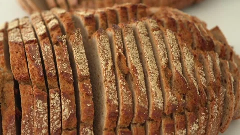 Sliced Whole Grain Bread Loaves on White Background Stock Footage 308376161