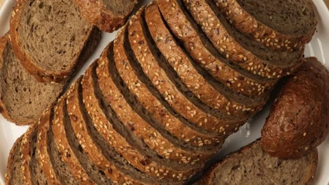 Sliced whole grain bread with seeds rotating Stock Footage 341822388