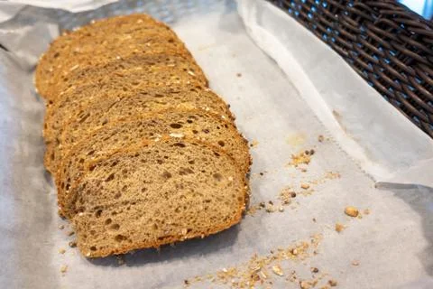 Sliced whole wheat bread served in basket ready for breakfast Stock Photos