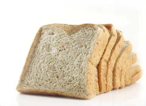 Sliced whole wheat bread on white background Stock Photos