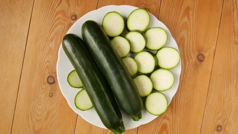 Sliced zucchini on a plate. Stock Footage 245681194