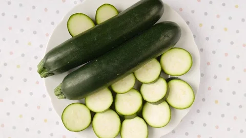 Sliced zucchini on a plate. Stock Footage 246730373