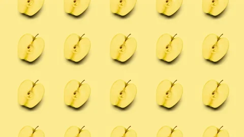 Slices of apple animation background, seamless looping. 4K Stock Footage 130928293