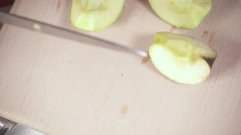 Slices of apples drop into a saucepan slow motion Video stock 88401477