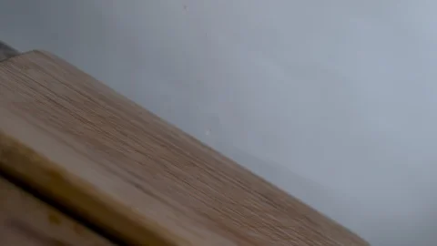 Slices of bell peppers falling on the chopping board in slow motion Stock Footage 100008199