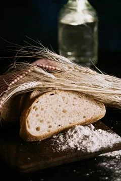 Slices of bread and wheat Stock Photos
