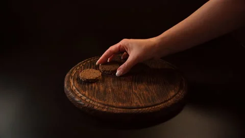 Slices of bread are laid out on a wooden table Video stock 148622728