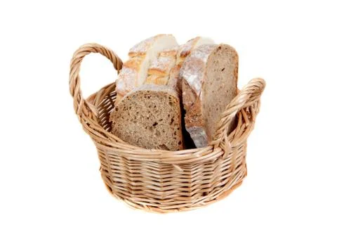 Slices of bread in basket, isolated Foto stock