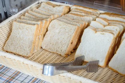 Slices of bread in basket Stock Photos