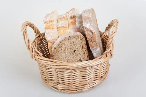 Slices of bread in basket Stock Photos